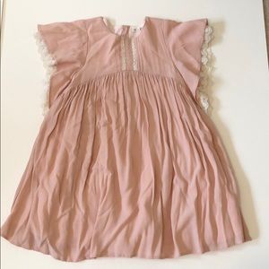 Girls blush designer dress with cap sleeve.
